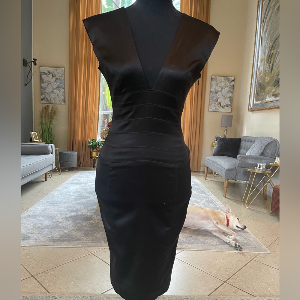 Black silk dress size 2. But fit like xxs. Sleeveless.
